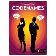 Codenames - Codenames board game box with silhouetted man and woman against orange and purple spiral background.
