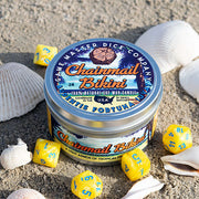 Chainmail Bikini Gaming Candle - Metal tin candle with a colorful Chainmail Bikini label surrounded by yellow gaming dice and seashells.