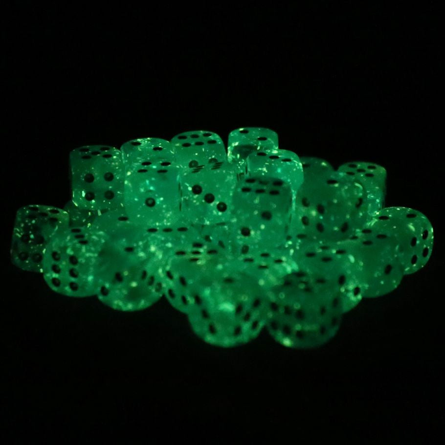 Chessex d6 Cube 12mm Luminary Sky with Silver (36) - Set of translucent green acrylic six-sided dice glowing in the dark with black pips and a smooth finish.
