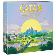 CATAN: New Energies - Catan New Energies board game box with sunset cityscape, highways, wind turbines, and solar panels in soft pastel colors.