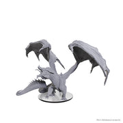 D&D Nolzur's Marvelous Minis: Adult Red Dragon Tyrant - Unpainted gray plastic miniature of a large dragon with outstretched wings and detailed scales on a round base.
