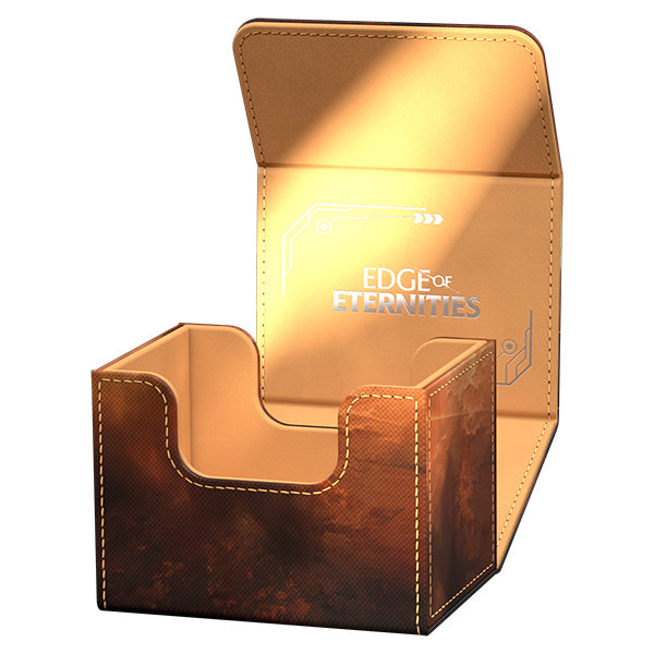 Ultimate Guard Sidewinder 100+ Xenoskin: Magic the Gathering: Edge of Eternities - Adagia, Windswept Bastion - Brown leather Ultimate Guard Sidewinder 100+ Xenoskin deck box with silver Edge of Eternities logo and decorative stitching.