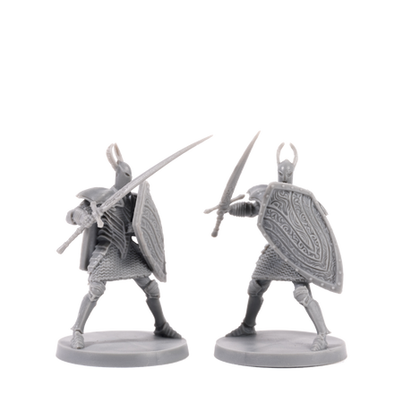 Dark Souls Mini: The Silver & The Dead - Two detailed gray plastic miniatures of armored knights wielding swords and large shields with intricate patterns.