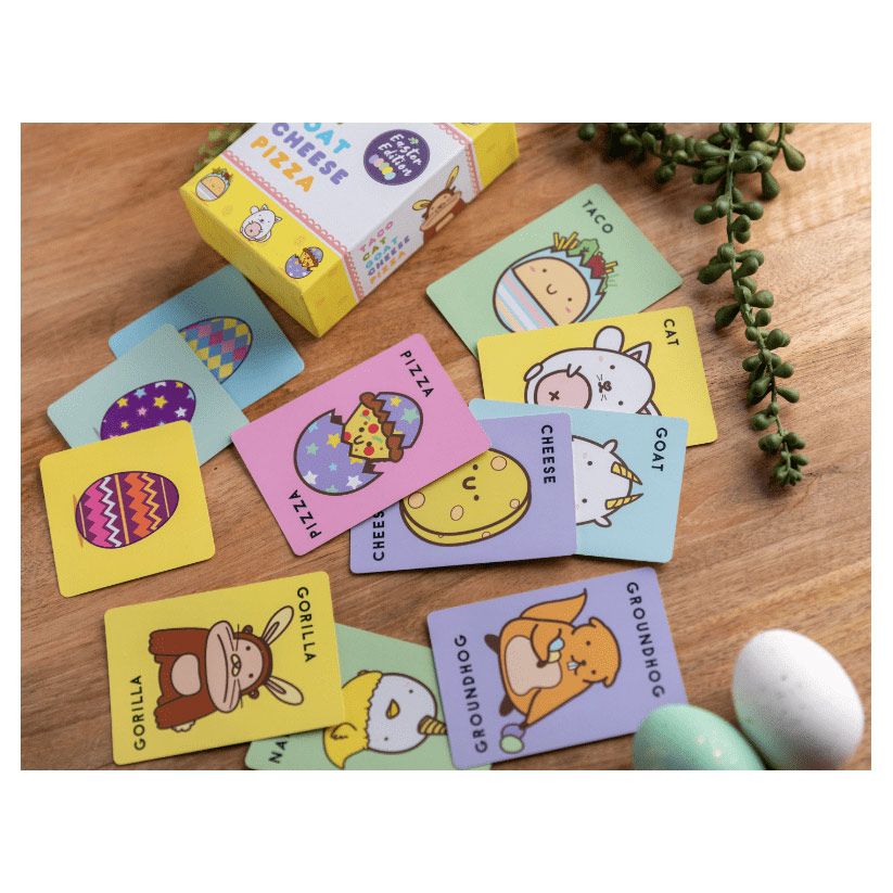 Taco Cat Goat Cheese Pizza Easter Edition - Colorful illustration cards featuring animals and food items spread on wood with pastel Easter-themed packaging and.