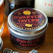 Dwarven Tavern Gaming Candle - Round metal tin candle with black and red label featuring a gold dwarven helmet and bold text "Dwarven Tavern," smoky scent.
