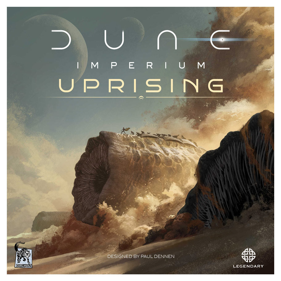 Dune: Imperium: Uprising - Board game box with dramatic desert landscape, rocky cliffs, sandstorms, and futuristic text reading Dune Imperium Uprising.