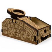 Monty Python's Dice Catapult - Wooden Monty Python-themed dice catapult with engraved medieval-style patterns and lever arm mechanism.