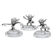 D&D Nolzur's Marvelous Miniatures: Boggles - Three unpainted gray plastic fantasy miniatures of boggles with large ears and wide eyes, each posed differently on round.