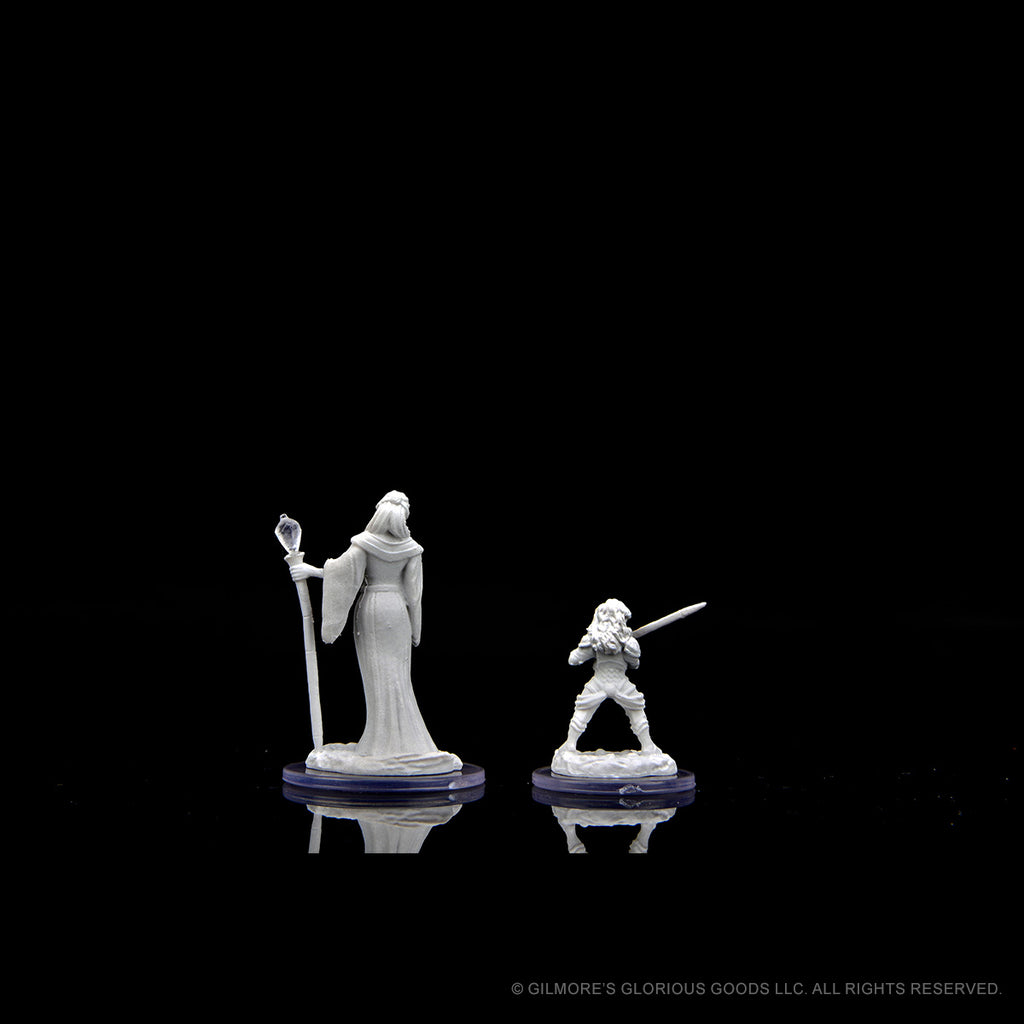 Critical Role Mini: Hum Wiz Fem & Halflin HW Fem - Two detailed gray fantasy miniatures on round bases, featuring a robed female wizard holding a staff and a small halfling.