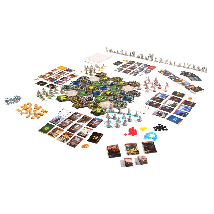 Monumental - Core Box - Colorful hexagonal board game with miniature figures, cards, tokens, and dice arranged on white background.