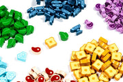 Flamecraft: Wooden Resources (2nd Edition) (PREORDER) - Assorted small wooden game tokens in green, blue, purple, yellow, red, and light blue representing resources for a board.