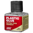 Army Painter Extra Thin Cement Plastic Glue - 40ml clear plastic glue bottle with black ribbed cap, red and beige label, white and yellow text.
