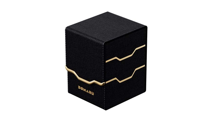Gatherers' Tavern: Domaru Armory Collection Vertex 100+ Deck Box - Obsidian (PREORDER) - Black rectangular deck box with gold angular lines and "DOMARU" text, textured surface.