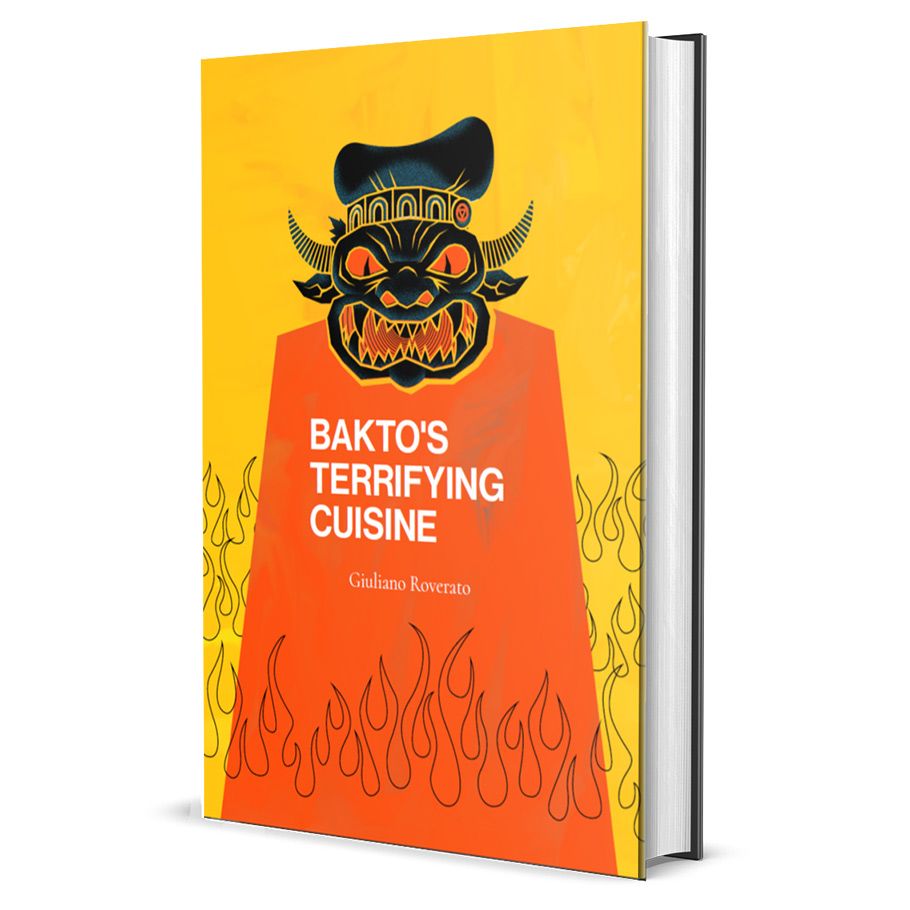 Bakto’s Terrifying Cuisine - Hardcover book with bright yellow and orange cover featuring a stylized black and red tribal mask illustration and flames at