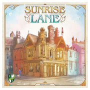 Sunrise Lane - Square board game box featuring a pastel-colored illustration of a vintage Victorian-style house with ornate chimneys.