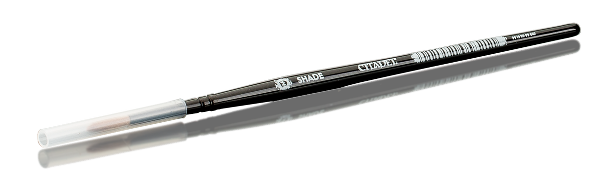 Medium-sized paintbrush with black handle and white bristles, Citadel brand.