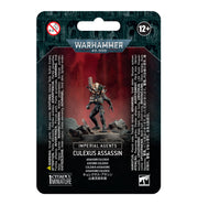 Warhammer 40,000 - Imperial Agents - Culexus Assassin - Culexus Assassin miniature in black armor with white skull-like mask, posed with outstretched weapon on rocky base.