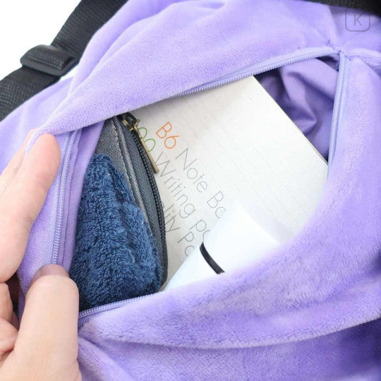 Pokémon Plush Ruck Sack - Ditto - Light purple plush backpack with soft texture, zippered front pocket holding notebook and towel.