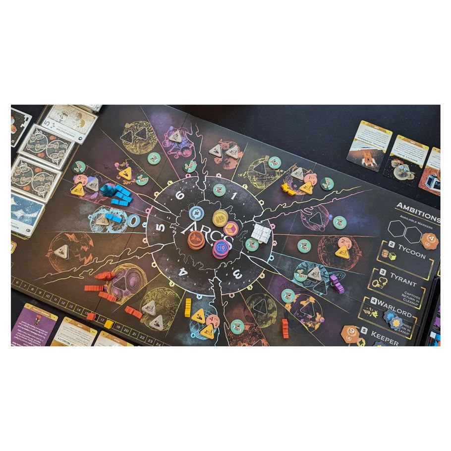 Arcs: Conflict & Collapse in the Reach - Board game with dark-themed circular map, colorful tokens, and various cards arranged on sides.