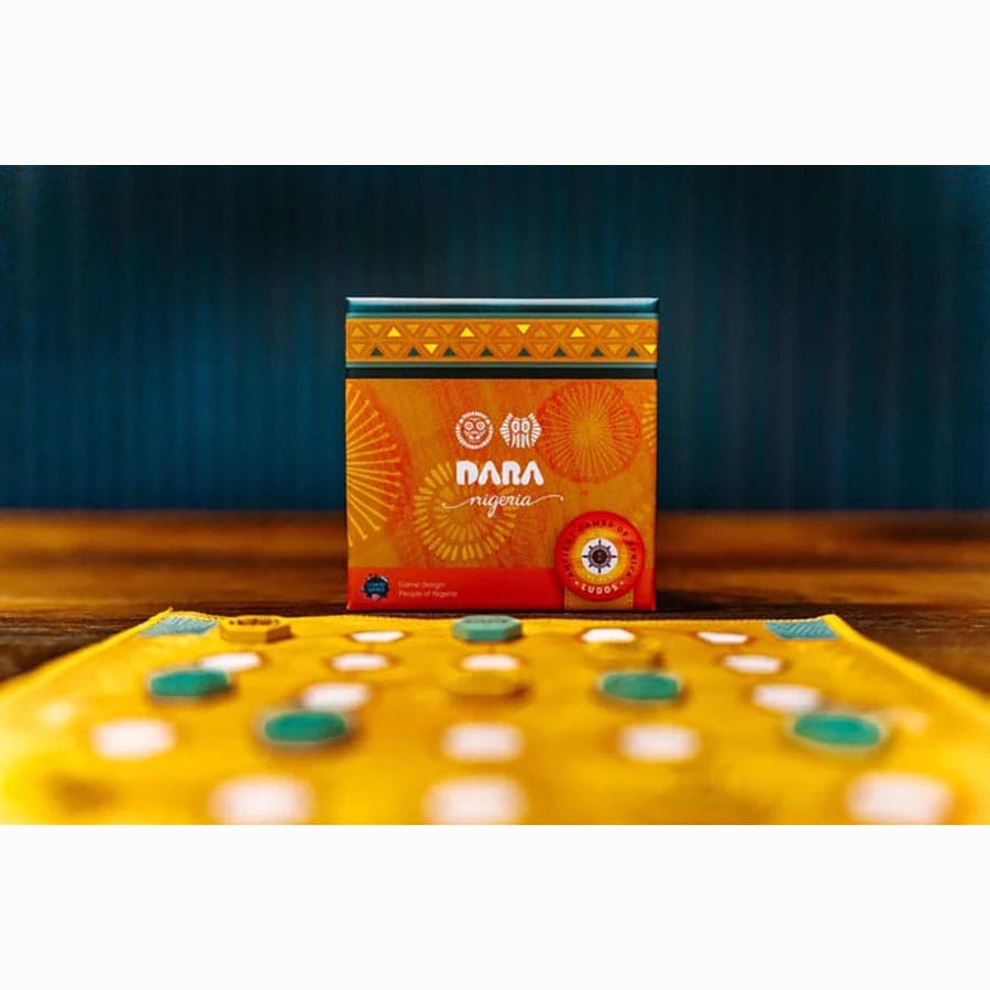 Ludos Africa Collection - Rectangular orange board game box with African-inspired patterns, featuring a wooden game board with blue and white circular
