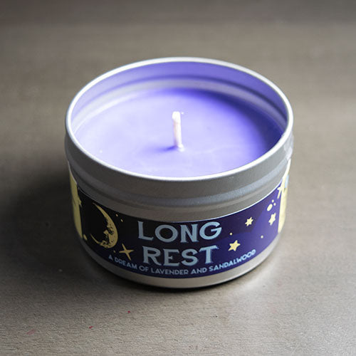 Long Rest Gaming Candle - Purple wax candle in a round silver tin labeled Long Rest with stars and moon design.