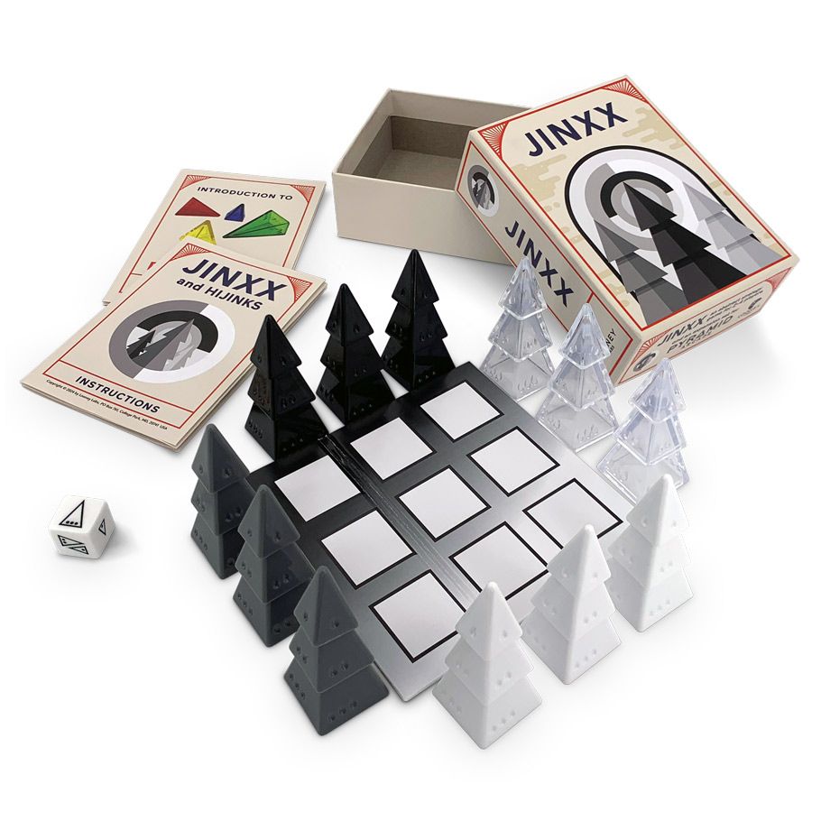 Jinxx - Jinxx strategy game with black and white triangular pieces, a square grid board, two rule booklets, and a white four-sided.