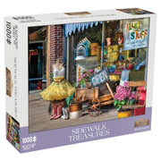 Sidewalk Treasures 1000 Piece Puzzle - 1000-piece puzzle box featuring a colorful, detailed storefront scene with mannequins, flowers, potted plants, and a rustic.