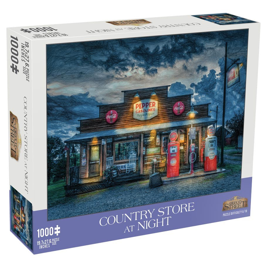 Country Store at Night 1000 Piece Puzzle - 1000-piece puzzle box featuring a vintage country store at night with glowing lights and a dark blue sky.