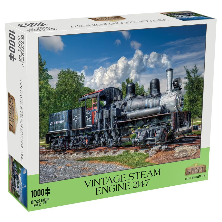 Vintage Steam Engine 1000 Piece Puzzle - Boxed 1000-piece puzzle featuring a detailed black vintage steam engine train with greenery and blue sky background.