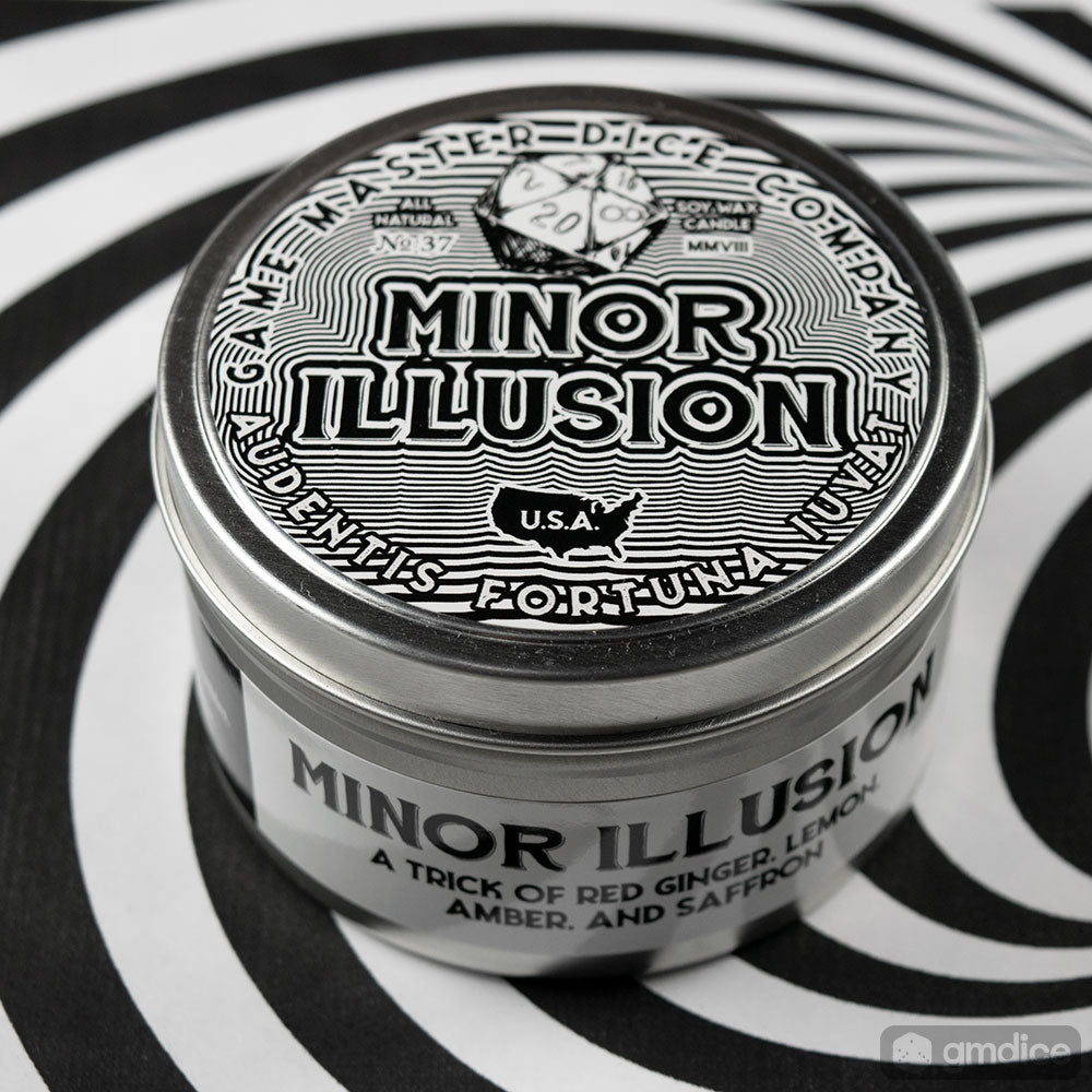 Minor Illusion Gaming Candle - Round silver tin candle with black and white label reading Minor Illusion featuring dice and decorative text.