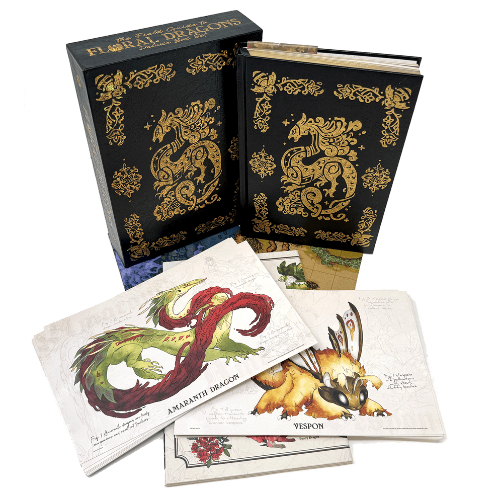 The Field Guide to Floral Dragons: Dragon Bestiary Box Set, Deluxe Edition (5e) - Deluxe black slipcase and book with gold floral dragon designs, accompanied by illustrated dragon art cards.