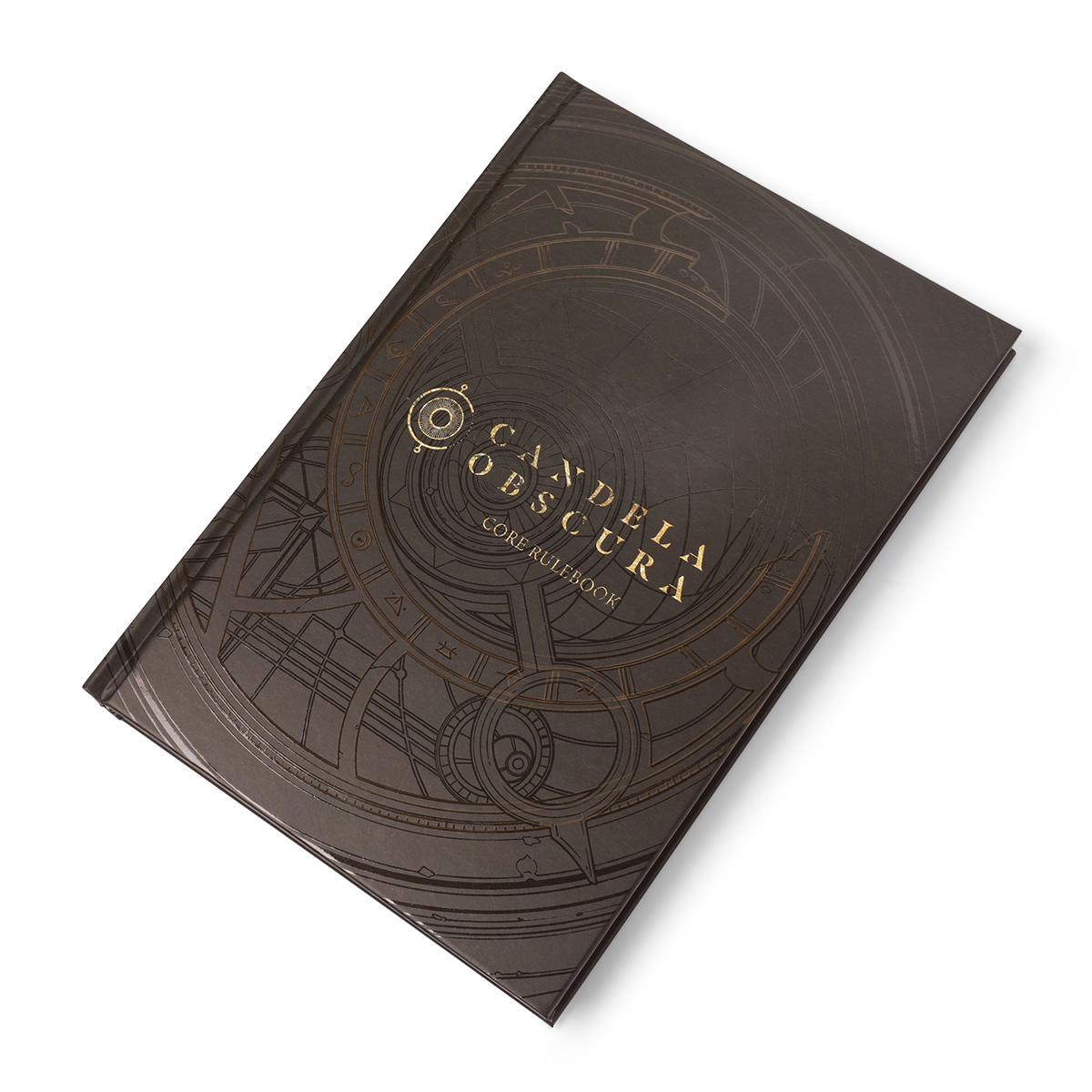Candela Obscura Core Rulebook - Standard Edition - Dark brown hardcover book with intricate circular line art and gold embossed title "Candela Obscura" on the front cover.