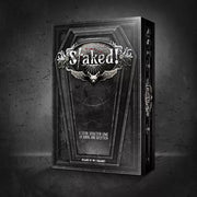 Staked! (Deluxe Edition) - Dark coffin-shaped box with metallic silver gothic lettering "Staked!" and intricate decorative flourishes on the front.