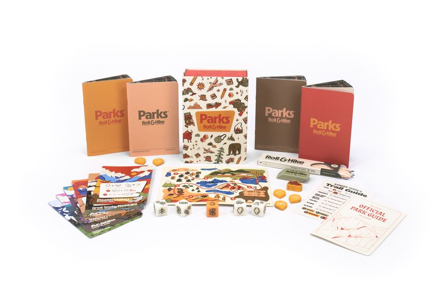 Parks Roll and Hike - Parks Roll and Hike game set with colorful cards, wooden board, tokens, and four differently colored boxes on a white.