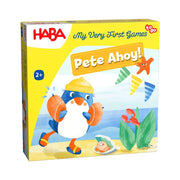 My Very First Games To Go: Pete Ahoy - Colorful kids game box featuring a penguin in a yellow sailor hat playing by the seaside with shells and seaweed on a yellow