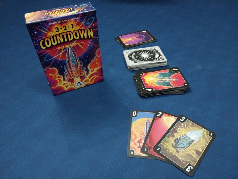 3-2-1 Countdown - 3-2-1 Countdown card game box with colorful space-themed cards spread on blue background.