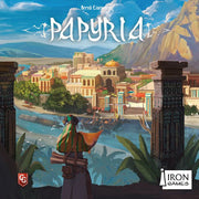 Papyria (PREORDER) - Colorful board game box cover art depicting an ancient cityscape with mountains, river, and a cloaked figure overlooking the