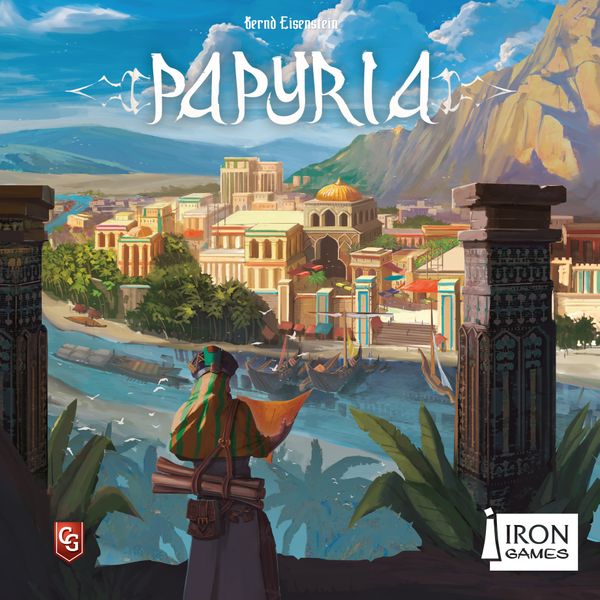 Papyria (PREORDER) - Colorful board game box cover art depicting an ancient cityscape with mountains, river, and a cloaked figure overlooking the