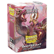 Deck Protector: Dragon Shield: Dual Matte: Pomegranate & Gold (100) - Box of Dragon Shield Dual Matte card sleeves in pomegranate red and gold with dragon artwork and anniversary edition label.