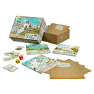 Trek 12 - Trek 12 family board game with illustrated mountain cards, dice, and score sheets on a table.