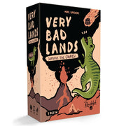 Very Bad Lands: T-Rex - Rectangular box for Very Bad Lands family game with a green T-Rex dinosaur leaping near an erupting volcano on a peach and.