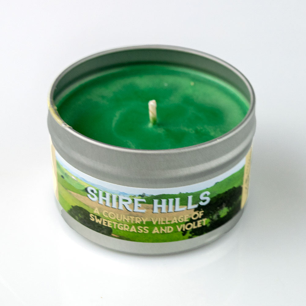 Shire Hills Candle - Green wax candle in a small silver metal tin with a countryside label reading "Shire Hills".