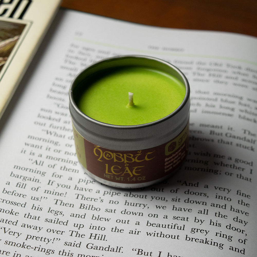 Hobbit Leaf Gaming Candle - Green round candle in a metal tin with gold Hobbit Leaf lettering on the side.