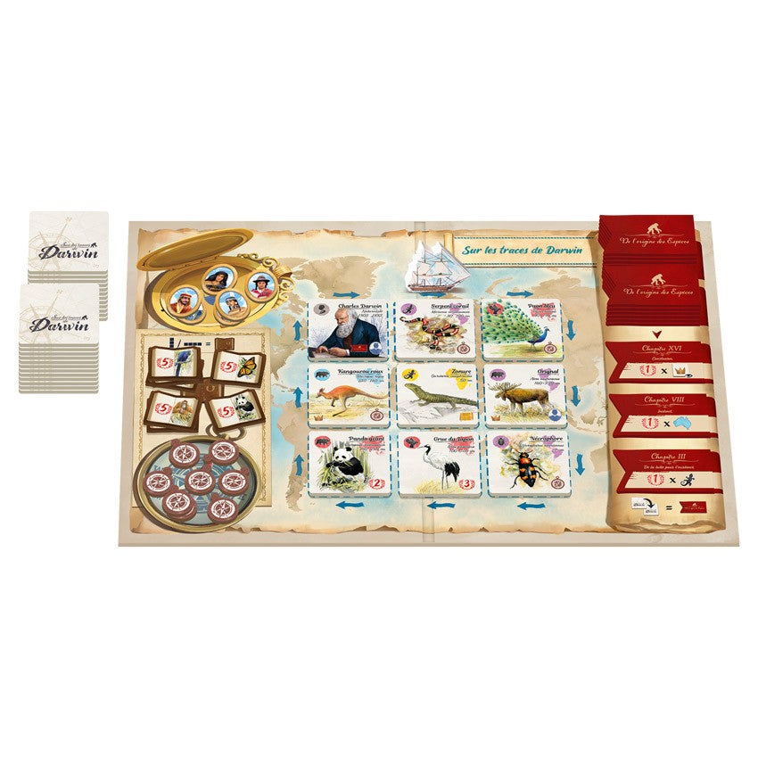In the Footsteps of Darwin - Board game set with animal cards, red and white card decks, circular tokens, and illustrated game board detailing species.