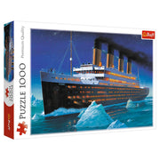 Titanic 1000 Piece Puzzle - Titanic 1000-piece puzzle box featuring an illustrated nighttime view of the Titanic ship sailing near icebergs under a dark