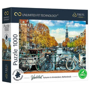 Wanderlust - Autumn in Amsterdam 1000 Piece Puzzle - 1000-piece puzzle box featuring an autumn canal scene in Amsterdam with bikes, colorful trees, and historic buildings.