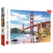 Golden Gate Bridge 1000 Piece Puzzle - 1000-piece puzzle box featuring the Golden Gate Bridge in red against a blue sky and sandy beach scene.