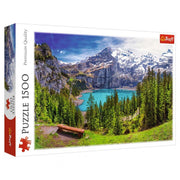 Puzzle: Lake Oeschinen, Alps 1500pc - 1500-piece puzzle featuring vibrant alpine lake with turquoise water, pine trees, and snow-capped mountains.