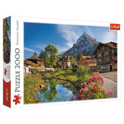 Puzzle: Alps in the Summer 2000pc - 2000-piece puzzle featuring a vibrant summer Alps village scene with mountains, greenery, and flowers.