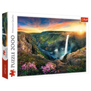 Haifoss Waterfall Iceland 2000 Piece Puzzle - 2000-piece puzzle featuring Haifoss waterfall in Iceland with vibrant sunset and blooming pink flowers.